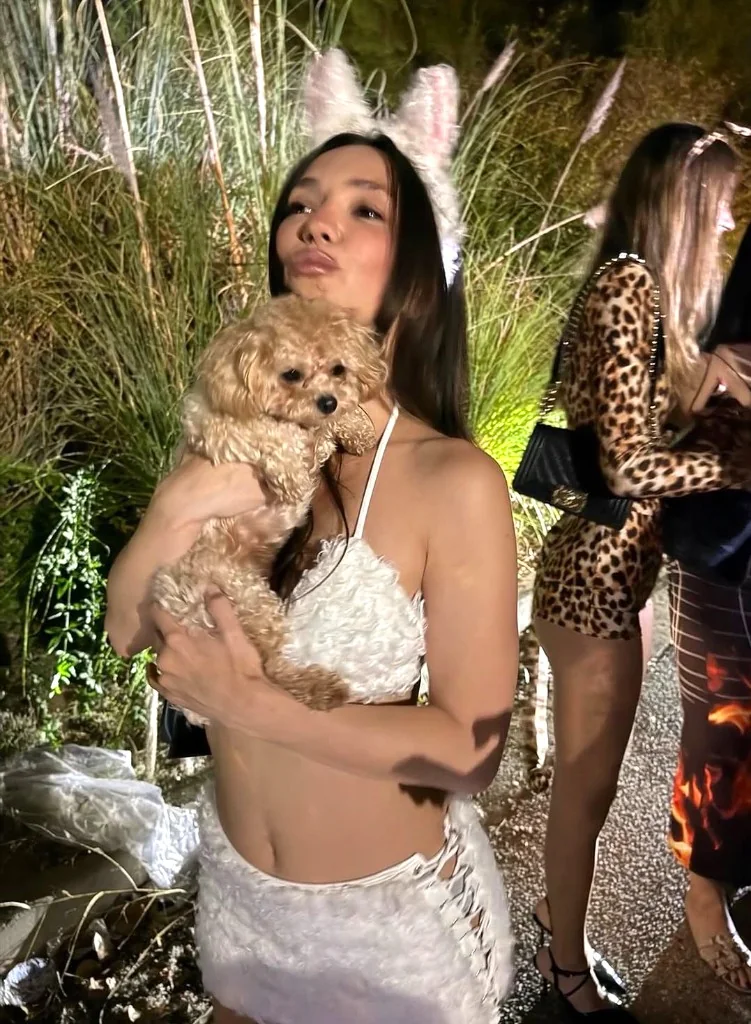 Events — guest holding a Star Poodlez at an evening event