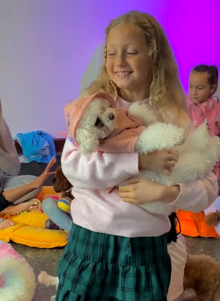 Birthday parties — child cuddling a Star Poodlez