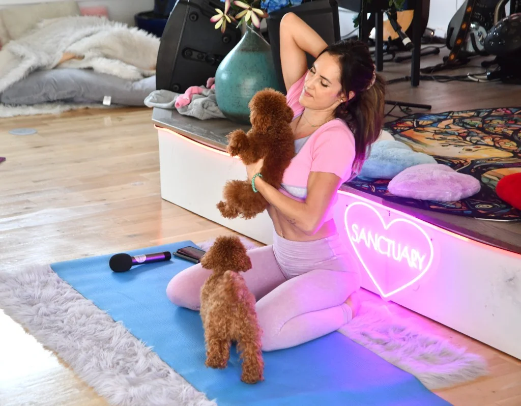 Yoga classes — instructor with poodles during class